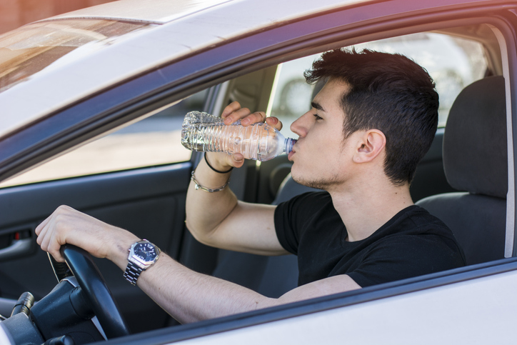 Should you be fined for drinking water behind the wheel on a hot day?