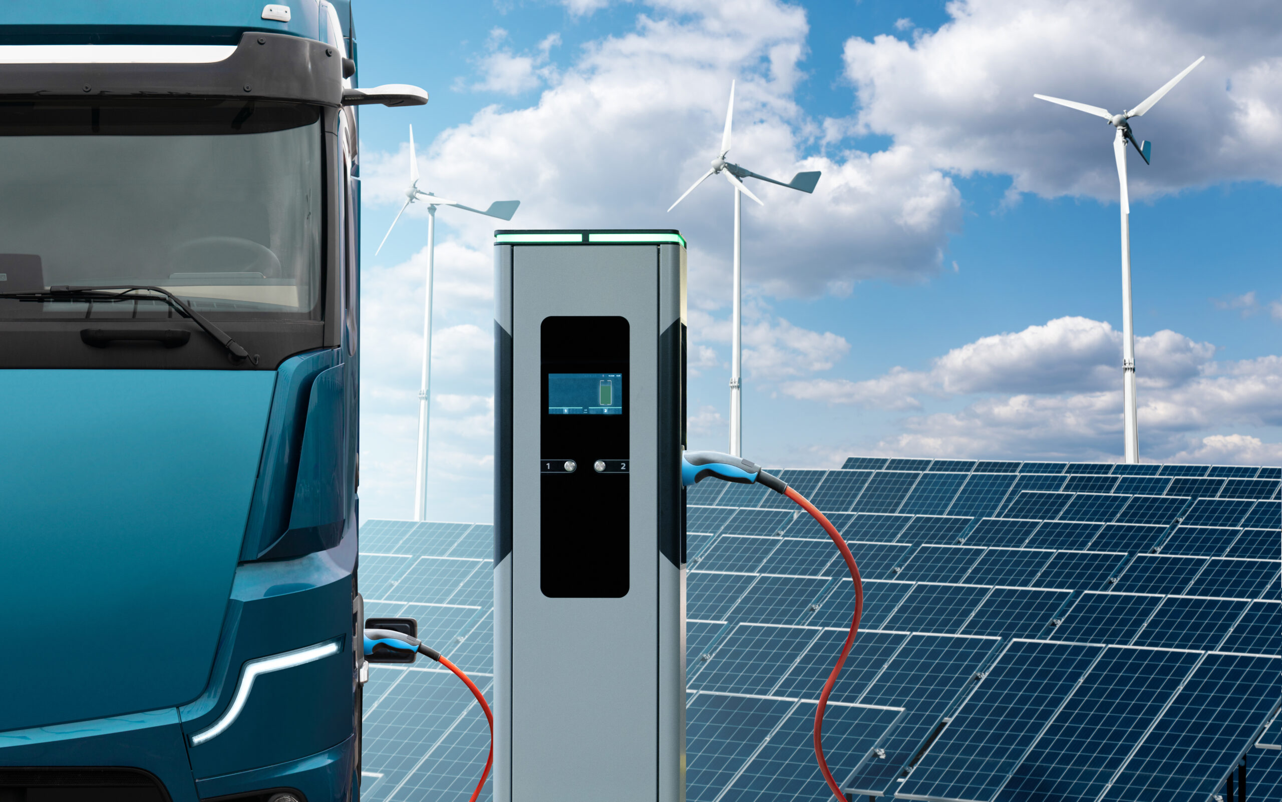 Electric truck charging with solar panels and wind power.